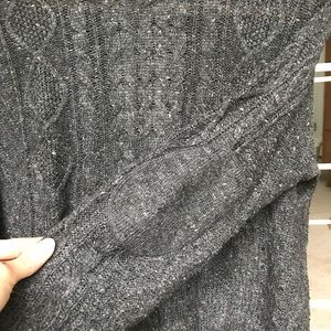 Cable knit sweater with elbow patches.